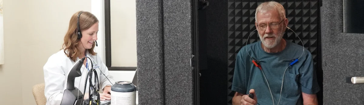 Dr. Rierson conducting a hearing test in the Dension, IA audiologist office.