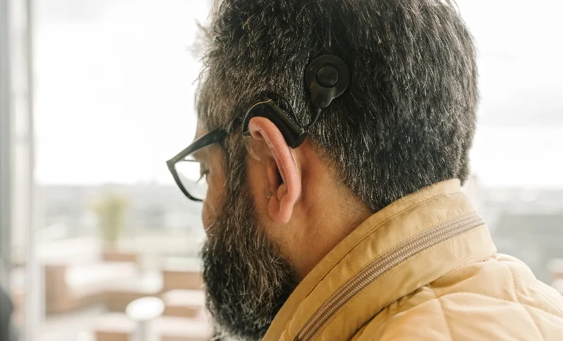 A man with a cochlear implant